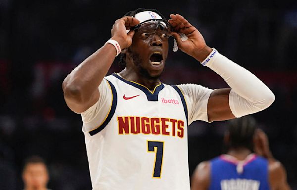 Guard Reggie Jackson traded from Denver Nuggets to Charlotte Hornets with three second-round picks