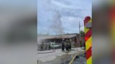 Crews respond after commercial building catches fire in Asheville