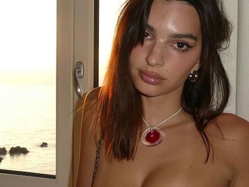 Emily Ratajkowski almost spills out of her top