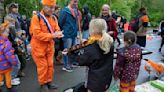 Orange crush: Boats packed with revelers tour Amsterdam canals celebrating the king's birthday