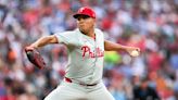 Phillies wait out an extra-inning rain delay, then outlast the Orioles 5-3 in 11