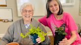 Assisted living community residents enjoy indoor gardening activity