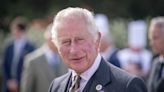 Charles strokes Clydesdale horses and enjoys carriage ride on Lanark visit