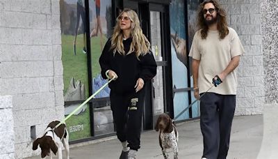 Heidi Klum keeps it casual in black sweatsuit with husband Tom Kaulitz as they walk their two German shorthaired pointers in LA