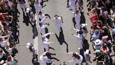 A Ukrainian gymnast carried the Paris Olympic torch with an EU team, in a sign of support