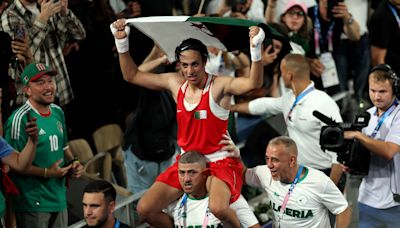 7 photos of Algerian boxer Imane Khelif triumphantly celebrating her gold medal victory at the Olympics