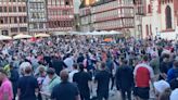 Heavy police presence and smashed bottles as England fans take over German city