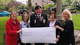 Villagers hand over £600 to help bereaved military children