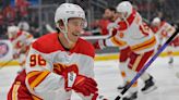 Kings wrap up playoff berth with win over Flames