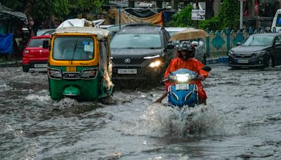 A tropical storm floods villages and cuts power to millions in parts of Bangladesh and India