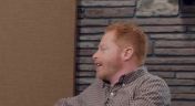 8. Jesse Tyler Ferguson Wears a Brown Checked Shirt and Stripey Socks