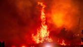 California’s largest wildfire explodes in size as fires rage across US west