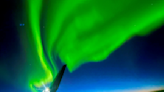 Photographer captures 'magical' mid-air view of northern lights thanks to flight delay