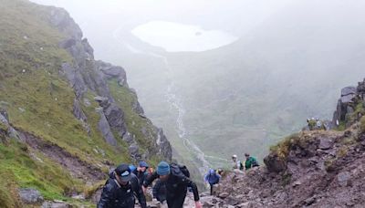 Cork dentists brave ‘challenging’ conditions to climb Carrauntoohill to raise funds for charity