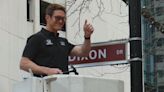 Indy 500 driver Scott Dixon installs downtown street sign with his name