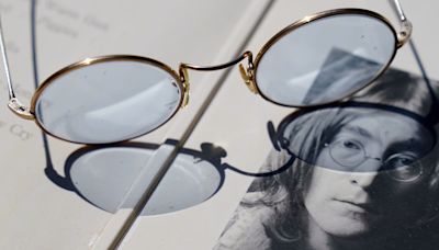 Blue-tinted glasses given by John Lennon to be auctioned with Abbey Road photos