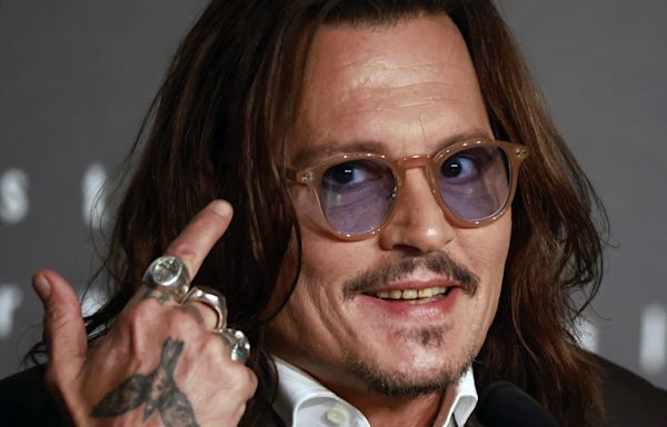 Johnny Depp parties in the Caribbean, but no longer has teeth of a pirate