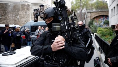 Police surround Iran's consulate in Paris as man threatens to blow himself up