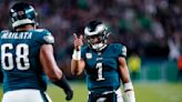 Jalen Hurts shakes off knee injury and leads Eagles past Cowboys 28-23 for NFL best 8-1 mark