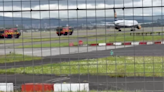 Plane tyre 'smokes' on Glasgow Airport runway as fire crews rush to scene