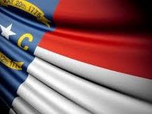 Why are flags flying at half-staff in North Carolina?