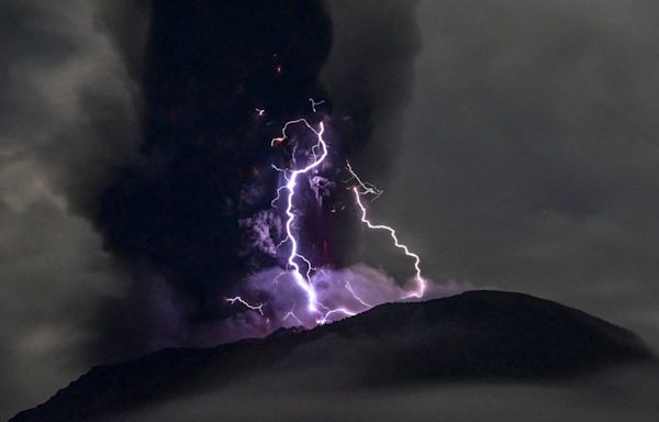 Indonesia’s Mount Ibu volcano eruption shoots grey ash clouds into sky