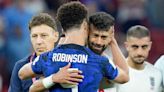 USA's Antonee Robinson comforted a sobbing Iranian soccer player after the Americans knocked their team out at the World Cup