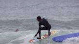 The Real Johnny Tsunami: Surfer Shreds a Wave on a Snowboard