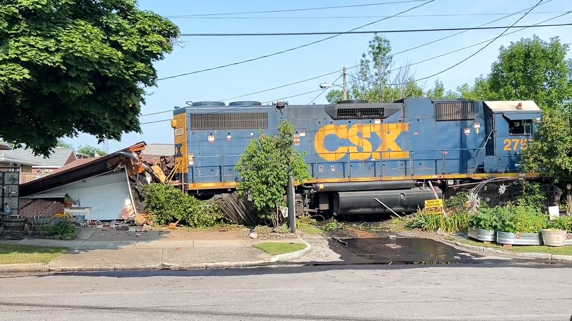 CSX train derails off tracks, crashing into home's garage