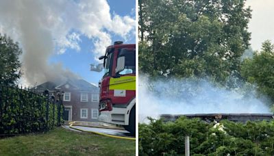 Part of roof caves in as eight fire engines continue to tackle blaze