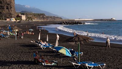 Inside eerie island with the world’s newest beach which is BLACK after eruption