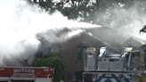 Smoke pours from home as crews tackle fire