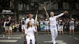 A Lebanese photojournalist, wounded in Israeli strike, carries Olympic torch to honour journalists