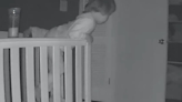 Baby monitor shows sweet moment toddler climbs out of crib to comfort crying brother