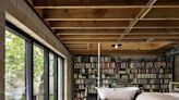 A Wall of Books Puts the Finishing Touch on This Rough-Hewn Backyard Home in Austin