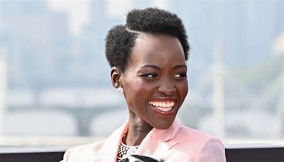 Why Did Lupita Nyong’o Accessorize Her Bubblegum Suit With a Live Cat?