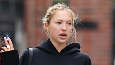 Lila Moss cuts a casual figure in a black hoodie as she steps out for a bite to eat with a group of girlfriends in NYC - after partying at Coachella