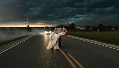 Newlyweds pose for epic wedding photos as thunderstorm looms: 'How is this real?'