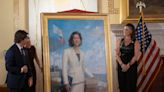 Former Gov. Gina Raimondo's official portrait looks different in more than the obvious way
