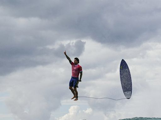 This surfer already won the Olympics with his gravity-defying pose