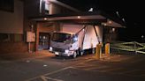 Box truck stuck under awning at Pawtucket business