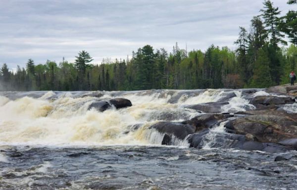 Rescue efforts for canoeists who went over Minnesota waterfall continue; Guard deployed