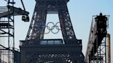 Paris Olympics organizers unveil a display of the five Olympic rings mounted on the Eiffel Tower