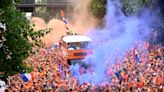 Orange bus leads Dutch fan parade at Euros