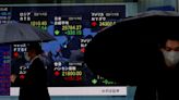 Asian shares rise, dollar wobbles after 'dovish' Powell comments