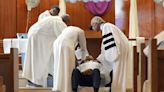 New York City Mayor Eric Adams gets baptized in jail by Rev. Al Sharpton on Good Friday
