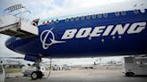 Boeing names next CEO while posting quarterly loss of more than $1.4 billion