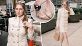Anna Delvey brings some bling to immigration court in a chic white suit dress and bedazzled ankle monitor