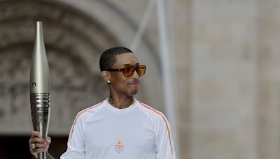 Pharrell Williams Carries Torch at Paris 2024 Olympics