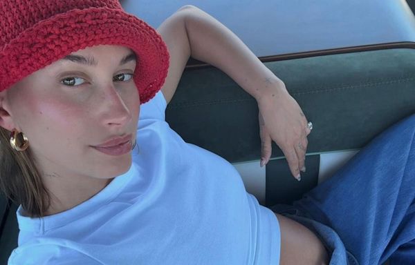 Pregnant Hailey Bieber Shares Peek at Her Bare Bump in Denim Overalls: 'Summer So Far'